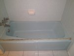 Before and after photos of resurfaced and refinished bathtubs in Austin, Texas.